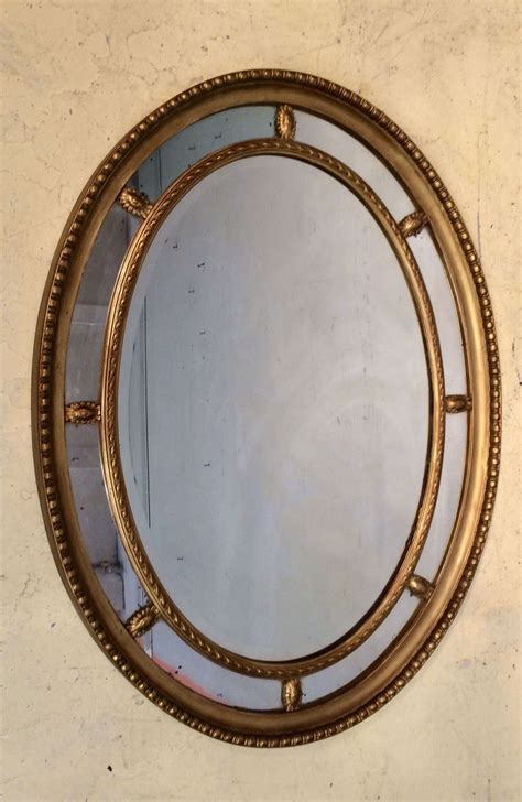 antique oval mirror carved wood.